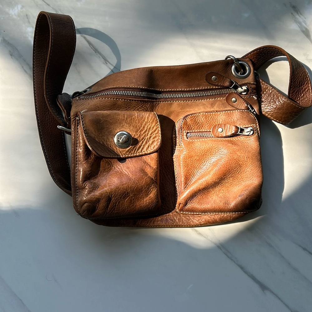 Brown leather Roots crossbody bag.